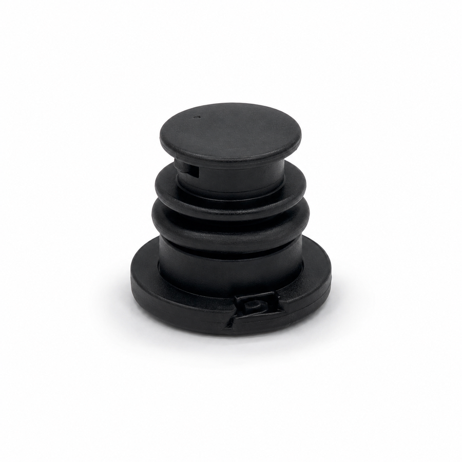 OEM Audi VW Skoda SEAT oil sump drain plug part number 06L103801, black plastic construction with integrated rubber sealing ring, isolated on a white studio background.